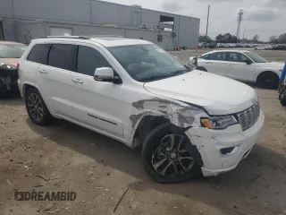 2018 Jeep Grand Cherokee Overland with VIN 1C4RJFCG5JC437508, listed as a Copart auction lot 51814795 with 104,598 mi miles and Salvage title. Bid and sale history available at DreamBid. Image 4.