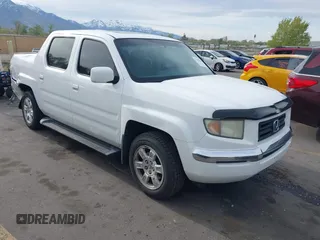 2006 Honda Ridgeline RTL z VIN 2HJYK16586H519593, wystawiony jako IAAI lot #42111678 z przebiegiem 244 962 mil mil oraz . Historia ofert i sprzedaży dostępna na DreamBid. Obrazek 1.
