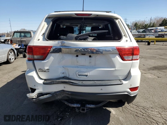 2011 Jeep Grand Cherokee Laredo with VIN 1J4RR4GG3BC671780, listed as a Copart auction lot 49179835 with 166,521 mi miles and Salvage Title. Bid and sale history available at carsss.com. Image 6.