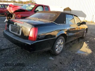 2003 Cadillac DeVille DTS z VIN 1G6KF57963U245281, wystawiony jako Copart lot #79911554 z przebiegiem Nie podano mil oraz Szkody całkowita. Historia ofert i sprzedaży dostępna na DreamBid. Obrazek 3.