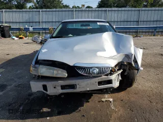 1997 Mercury Cougar z VIN 1MELM6245VH627028, wystawiony jako Copart lot #65533884 z przebiegiem 74 360 mil mil oraz Szkody całkowita. Historia ofert i sprzedaży dostępna na DreamBid. Obrazek 5.