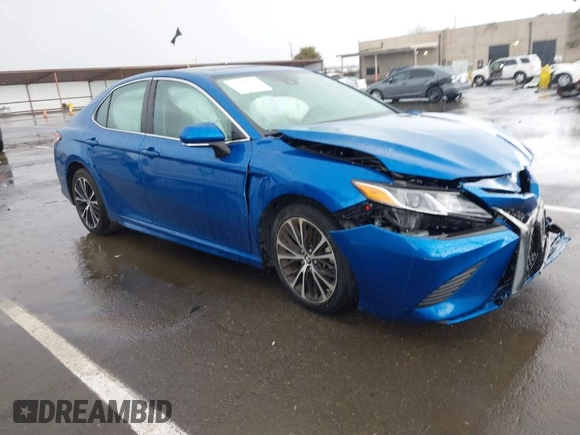 2019 Toyota Camry LE z VIN 4T1B11HK1KU282870, wystawiony jako IAAI lot #41799625 z przebiegiem 63 977 mil mil oraz . Historia ofert i sprzedaży dostępna na DreamBid. Obrazek 1.