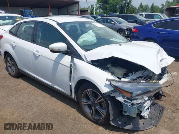 2018 Ford Focus SE z VIN 1FADP3FE5JL267982, wystawiony jako IAAI lot #42646881 z przebiegiem 40 163 mil mil oraz . Historia ofert i sprzedaży dostępna na DreamBid. Obrazek 1.