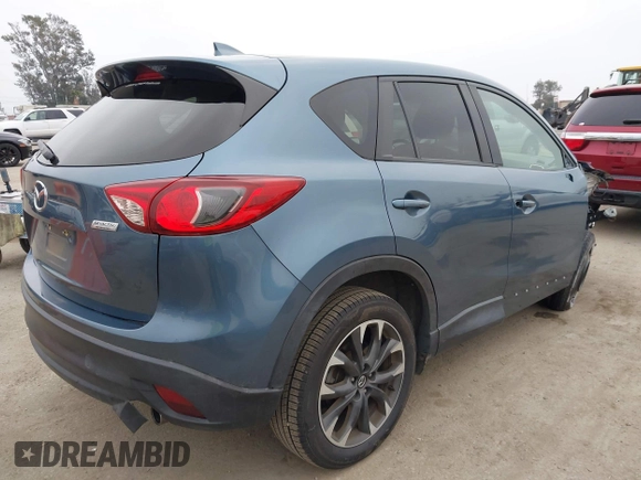 2016 Mazda CX-5 Grand Touring with VIN JM3KE2DY7G0875678, listed as a IAAI auction lot 42104888 with 30,566 mi miles. Bid and sale history available at carsss.com. Image 4.