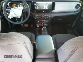 2024 Jeep Wrangler Sport S with VIN 1C4PJXDG2RW346671, listed as a Copart auction lot 57966375 with 9,430 mi miles and Salvage title. Bid and sale history available at DreamBid. Image 8.