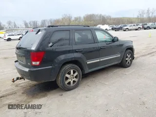 2009 Jeep Grand Cherokee Laredo with VIN 1J8GR48K19C546439, listed as a IAAI auction lot 42097256 with 146,930 mi miles. Bid and sale history available at carsss.com. Image 4.