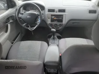 2005 Ford Focus S with VIN 1FAFP34N45W285454, listed as a Copart auction lot 59043485 with 165,071 mi miles and Salvage title. Bid and sale history available at DreamBid. Image 8.