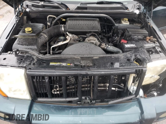 2006 Jeep Commander with VIN 1J8HH48NX6C125803, listed as a Copart auction lot 71247304 with 214,297 mi miles and Salvage Title. Bid and sale history available at carsss.com. Image 12.
