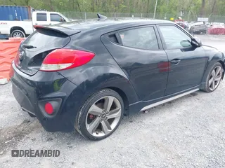 2013 Hyundai Veloster Turbo z VIN KMHTC6AE7DU106831, wystawiony jako IAAI lot #42115348 z przebiegiem 166 914 mil mil oraz . Historia ofert i sprzedaży dostępna na DreamBid. Obrazek 4.
