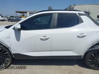 2023 Hyundai Santa Cruz SEL Premium z VIN 5NTJDDAF2PH075610, wystawiony jako IAAI lot #41855459 z przebiegiem 17 872 mil mil oraz . Historia ofert i sprzedaży dostępna na DreamBid. Obrazek 13.