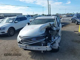 2015 Ford Taurus SEL z VIN 1FAHP2E81FG105404, wystawiony jako IAAI lot #40888773 z przebiegiem Nie podano mil oraz . Historia ofert i sprzedaży dostępna na DreamBid. Obrazek 11.