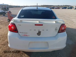 2014 Dodge Avenger SE with VIN 1C3CDZAB6EN180864, listed as a IAAI auction lot 41855043 with 99,977 mi miles. Bid and sale history available at carsss.com. Image 17.