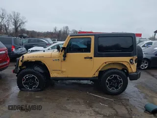 2013 Jeep Wrangler Rubicon 10th Anniversary with VIN 1C4BJWCG5DL688504, listed as a IAAI auction lot 41797184 with 109,414 mi miles and . Bid and sale history available at DreamBid. Image 14.