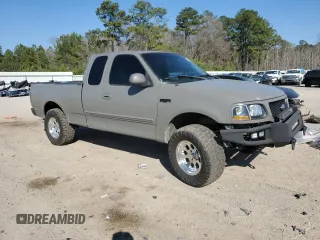 1999 Ford F-150 with VIN 1FTRX17W1XNC25527, listed as a Copart auction lot 48662525 with 150,544 mi miles and Salvage Title. Bid and sale history available at DreamBid. Image 4.