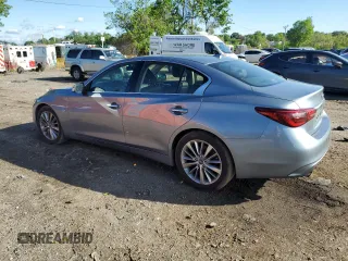 2018 Infiniti Q50 Luxe with VIN JN1EV7APXJM590569, listed as a Copart auction lot 55643215 with 86,965 mi miles and Salvage title. Bid and sale history available at DreamBid. Image 2.