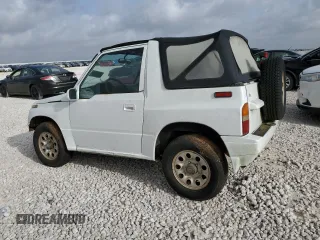 1994 Suzuki Sidekick z VIN 2S3TA01C8R6408593, wystawiony jako Copart lot #65011514 z przebiegiem 248 814 mil mil oraz Tytuł czysty. Historia ofert i sprzedaży dostępna na DreamBid. Obrazek 2.