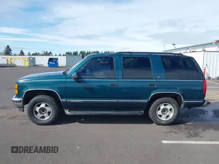 1999 GMC Yukon with VIN 1GKEK13R3XJ717999, listed as a IAAI auction lot 41870187 with 179,855 mi miles. Bid and sale history available at carsss.com. Image 14.
