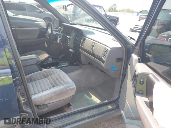 1994 Jeep Grand Cherokee Laredo z VIN 1J4GZ58Y7RC233746, wystawiony jako IAAI lot #42722206 z przebiegiem 196 875 mil mil oraz . Historia ofert i sprzedaży dostępna na DreamBid. Obrazek 5.