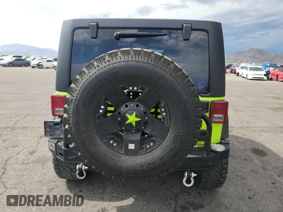 2012 Jeep Wrangler Unlimited Call of Duty MW3 z VIN 1C4BJWFG4CL242211, wystawiony jako Copart lot #59774555 z przebiegiem 117 463 mil mil oraz Szkoda całkowita • Salvage title. Historia ofert i sprzedaży dostępna na DreamBid. Obrazek 6.