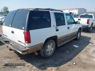 1996 GMC Yukon with VIN 1GKEK13R2TJ746811, listed as a IAAI auction lot 41955840 with 2,242,108 mi miles. Bid and sale history available at carsss.com. Image 4.