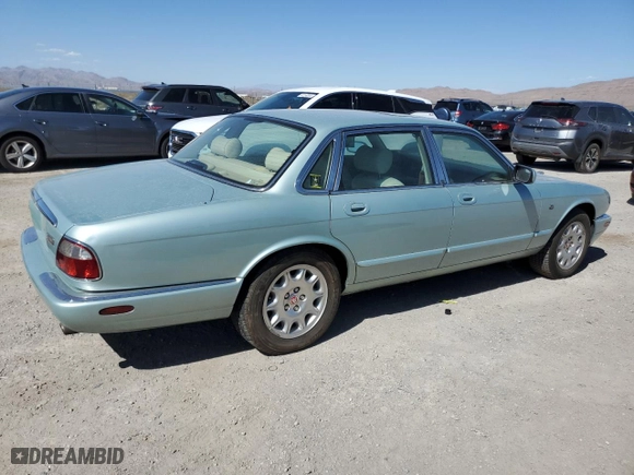 2000 Jaguar XJ with VIN SAJDA14C1YLF10459, listed as a Copart auction lot 65583394 with 113,333 mi miles and Salvage Title. Bid and sale history available at carsss.com. Image 3.