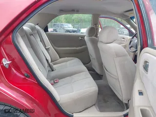 2000 Mazda 626 LX with VIN 1YVGF22C8Y5115891, listed as a IAAI auction lot 42121137 with 186,165 mi miles. Bid and sale history available at carsss.com. Image 8.