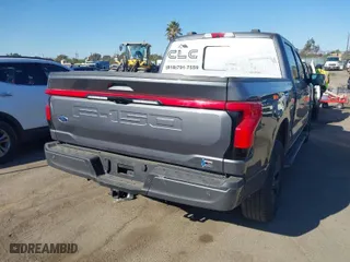 2022 Ford F-150 Lightning Pro with VIN 1FTVW1EL9NWG16717, listed as a IAAI auction lot 41290556 with 24,865 mi miles. Bid and sale history available at carsss.com. Image 4.