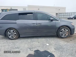 2014 Honda Odyssey Touring with VIN 5FNRL5H98EB008953, listed as a IAAI auction lot 42291179 with Not provided miles and . Bid and sale history available at DreamBid. Image 12.