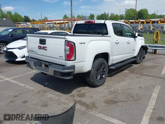 2019 GMC Canyon 4WD SLE z VIN 1GTG6CENXK1319647, wystawiony jako IAAI lot #42039568 z przebiegiem 56 371 mil mil oraz . Historia ofert i sprzedaży dostępna na DreamBid. Obrazek 4.