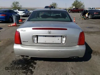 2004 Cadillac DeVille DTS z VIN 1G6KF57994U203706, wystawiony jako Copart lot #76278324 z przebiegiem 203 709 mil mil oraz Szkoda całkowita • Salvage title. Historia ofert i sprzedaży dostępna na DreamBid. Obrazek 6.