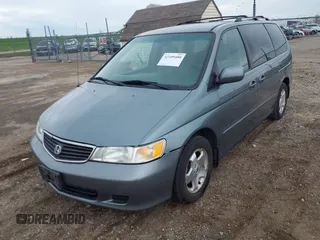 2000 Honda Odyssey EX z VIN 2HKRL1879YH516264, wystawiony jako IAAI lot #42109480 z przebiegiem 214 414 mil mil oraz . Historia ofert i sprzedaży dostępna na DreamBid. Obrazek 2.