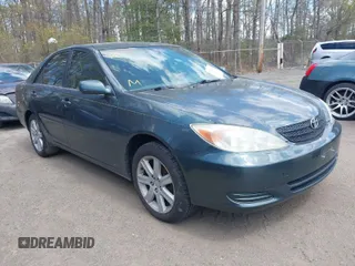 2002 Toyota Camry LE z VIN 4T1BE32K42U559410, wystawiony jako IAAI lot #42049243 z przebiegiem 186 042 mil mil oraz . Historia ofert i sprzedaży dostępna na DreamBid. Obrazek 1.