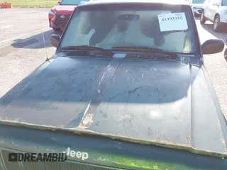 1999 Jeep Cherokee Sport with VIN 1J4FF68SXXL677013, listed as a IAAI auction lot 41993355 with 228,722 mi miles. Bid and sale history available at carsss.com. Image 12.