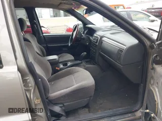 2001 Jeep Grand Cherokee Laredo z VIN 1J4GW48S01C658017, wystawiony jako IAAI lot #42160310 z przebiegiem 220 309 mil mil oraz . Historia ofert i sprzedaży dostępna na DreamBid. Obrazek 5.