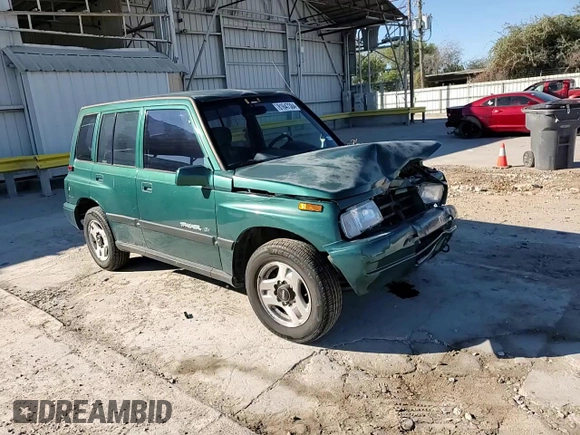 1996 Geo Tracker z VIN 2CNBE1363T6921541, wystawiony jako Copart lot #81647384 z przebiegiem 61 806 mil mil oraz Szkoda całkowita • Salvage title. Historia ofert i sprzedaży dostępna na DreamBid. Obrazek 12.