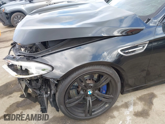 2016 BMW M5 z VIN WBSFV9C54GD595793, wystawiony jako IAAI lot #42101121 z przebiegiem 58 775 mil mil oraz . Historia ofert i sprzedaży dostępna na DreamBid. Obrazek 19.