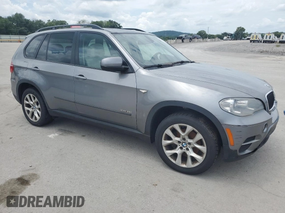 2012 BMW X5 35i with VIN 5UXZV4C59CL991689, listed as a Copart auction lot 64022615 with 208,620 mi miles and Salvage title. Bid and sale history available at DreamBid. Image 4.