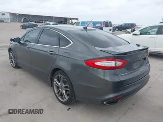 2015 Ford Fusion Titanium with VIN 3FA6P0K95FR181919, listed as a IAAI auction lot 41744443 with 127,572 mi miles. Bid and sale history available at carsss.com. Image 3.