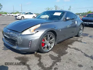 2013 Nissan 370Z with VIN JN1AZ4EH1DM880983, listed as a IAAI auction lot 41937876 with 130,613 mi miles. Bid and sale history available at carsss.com. Image 2.