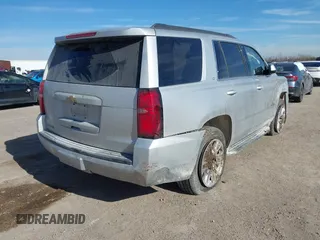 2020 Chevrolet Tahoe LT with VIN 1GNSCBKC5LR226822, listed as a IAAI auction lot 41334853 with 77,091 mi miles and . Bid and sale history available at DreamBid. Image 4.