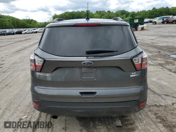2017 Ford Escape SE z VIN 1FMCU9GD7HUB76204, wystawiony jako Copart lot #58334725 z przebiegiem Nie podano mil oraz Szkoda całkowita • Salvage title. Historia ofert i sprzedaży dostępna na DreamBid. Obrazek 6.