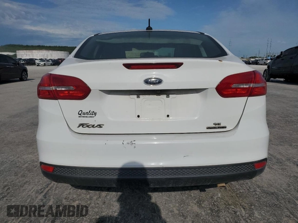 2015 Ford Focus SE with VIN 1FADP3F2XFL220072, listed as a Copart auction lot 58058255 with 128,871 mi miles and Clean title. Bid and sale history available at DreamBid. Image 6.