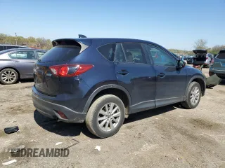 2014 Mazda CX-5 Touring with VIN JM3KE4CY4E0407868, listed as a Copart auction lot 52564315 with 137,989 mi miles and Salvage Title. Bid and sale history available at carsss.com. Image 3.