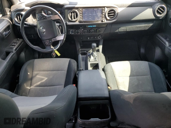 2023 Toyota Tacoma SR with VIN 3TMCZ5AN8PM545588, listed as a Copart auction lot 57528655 with 73,286 mi miles and Salvage title. Bid and sale history available at DreamBid. Image 8.