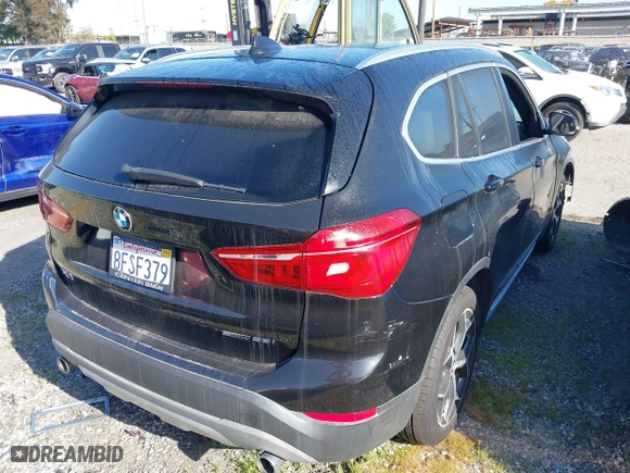 2018 BMW X1 sDrive28i with VIN WBXHU7C39J5L07129, listed as a IAAI auction lot 41472014 with 56,486 mi miles. Bid and sale history available at carsss.com. Image 4.