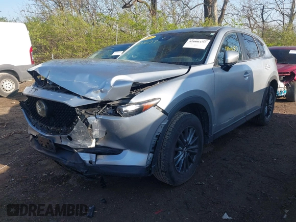 2020 Mazda CX-5 Touring with VIN JM3KFACM5L0766698, listed as a IAAI auction lot 42006157 with 80,288 mi miles and . Bid and sale history available at carsss.com. Image 6.