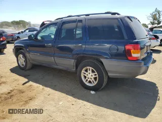 2004 Jeep Grand Cherokee Laredo with VIN 1J4GW48S34C343281, listed as a Copart auction lot 63253325 with 247,697 mi miles and Clean title. Bid and sale history available at DreamBid. Image 2.
