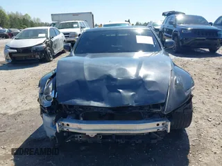 2009 Nissan 370Z z VIN JN1AZ44E19M405896, wystawiony jako IAAI lot #41889553 z przebiegiem 202 388 mil mil oraz . Historia ofert i sprzedaży dostępna na DreamBid. Obrazek 13.