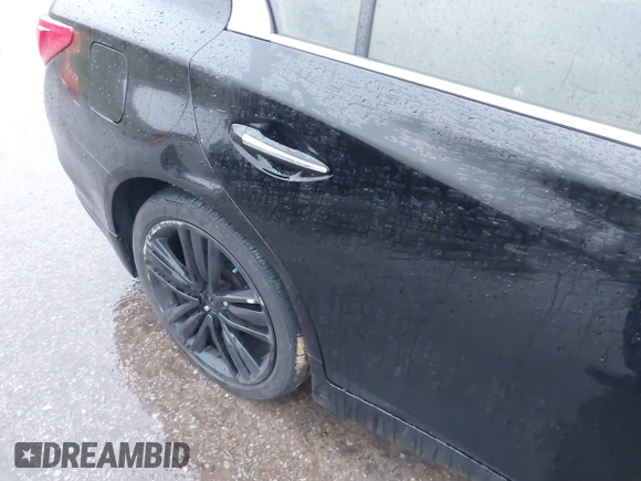 2015 Infiniti Q50 Premium z VIN JN1BV7ARXFM412382, wystawiony jako IAAI lot #40776813 z przebiegiem 66 406 mil mil oraz . Historia ofert i sprzedaży dostępna na DreamBid. Obrazek 6.