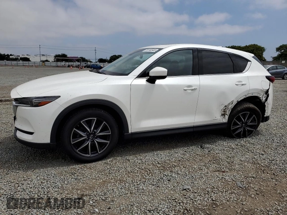 2018 Mazda CX-5 Grand Touring with VIN JM3KFADMXJ1358221, listed as a Copart auction lot 59746545 with 54,094 mi miles and Salvage title. Bid and sale history available at DreamBid. Image 1.